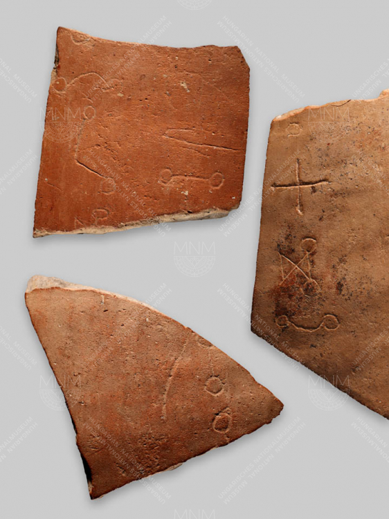 FRAGMENTS OF THE SIDE OF A POLISHED FLASK WITH ROUND GLAGOLITIC LETTERING