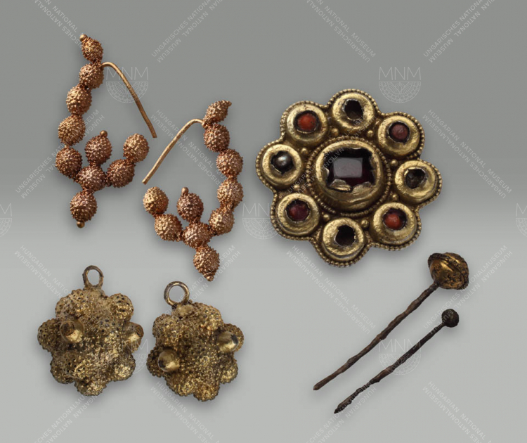 BURIAL OF A YOUNG FEMALE DIGNITARY: BUTTONS, DISK FIBULA, PAIR OF EARRINGS, AND HAIRPINS